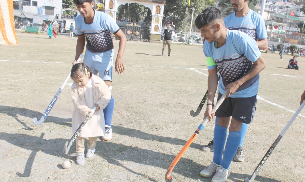 College students kept watching mobile, girl came to the field to play hockey with a stick
