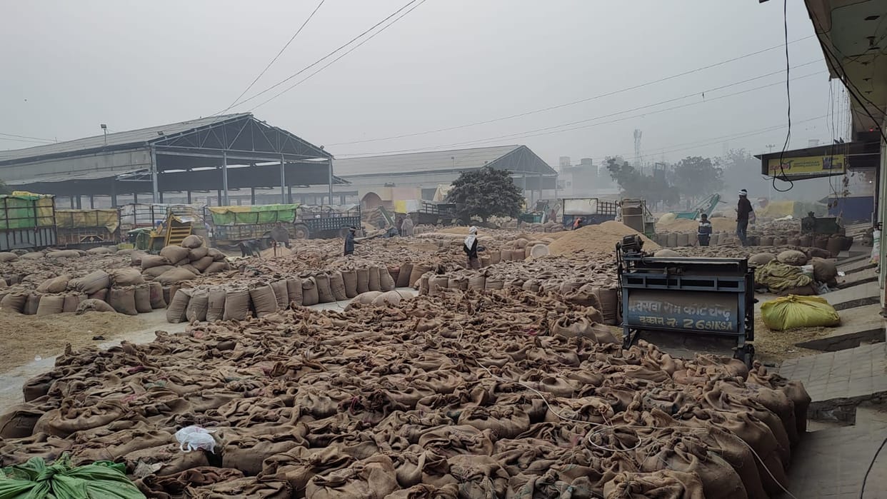 Market filled with paddy due to slow picking speed, farmers waiting outside all night