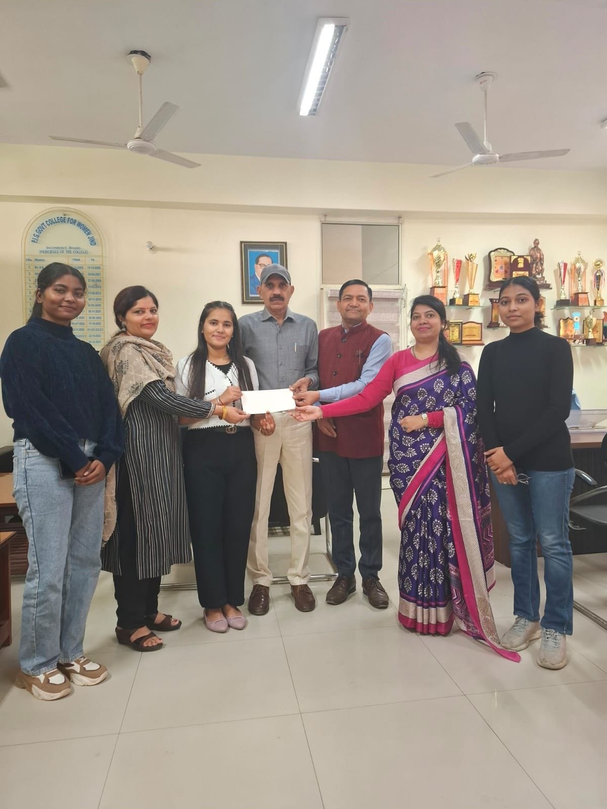 Principal honored Sneha and Preeti who won the national level online competition.