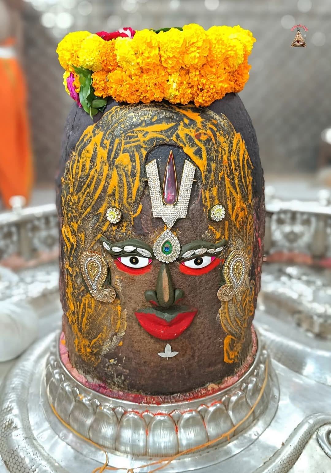 Mahakal Mandir Ujjain Baba Mahakal adorned with garland of peacock feathers during Bhasma Aarti