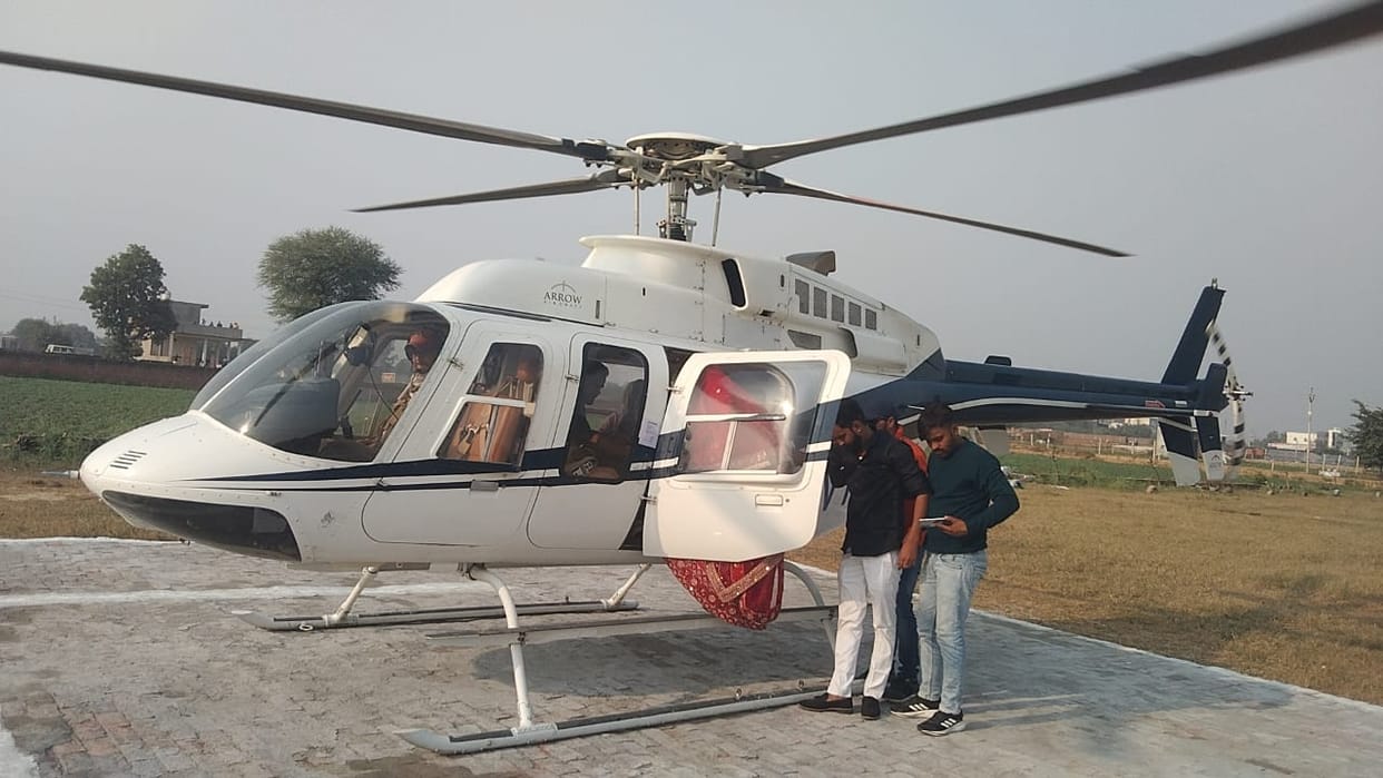 Villagers gathered to see the bride's departure by helicopter