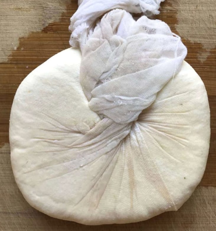 Paneer being prepared by mixing flour and arrowroot in milk
