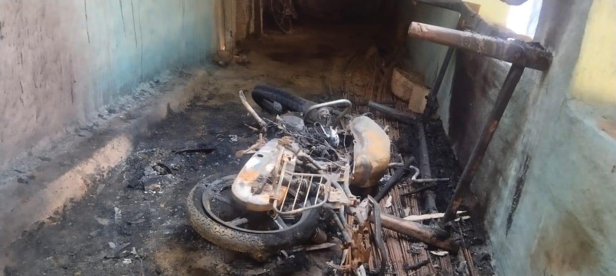 Unknown accused set fire to the motorcycle parked in the room of the house