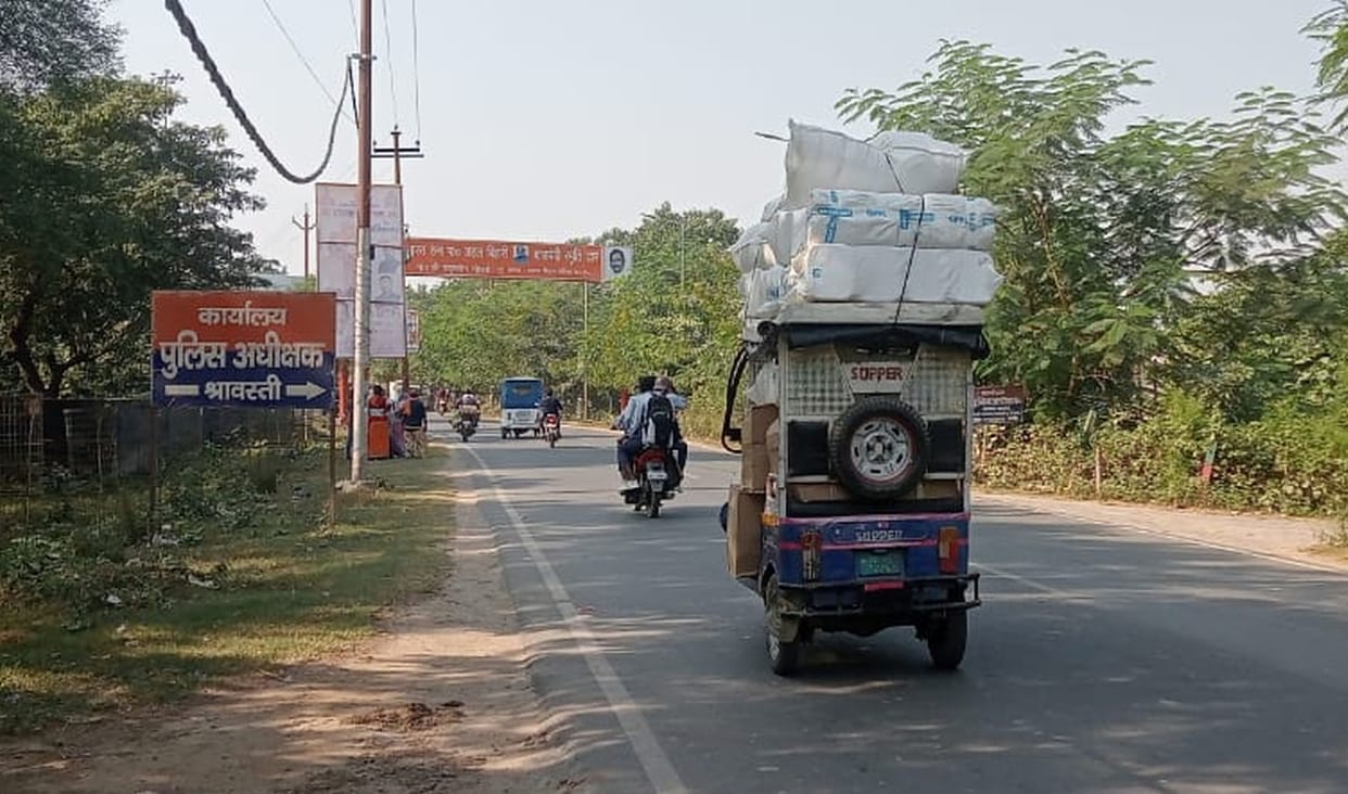 Passengers are being seated on heavy vehicles, passengers are carrying goods on vehicles