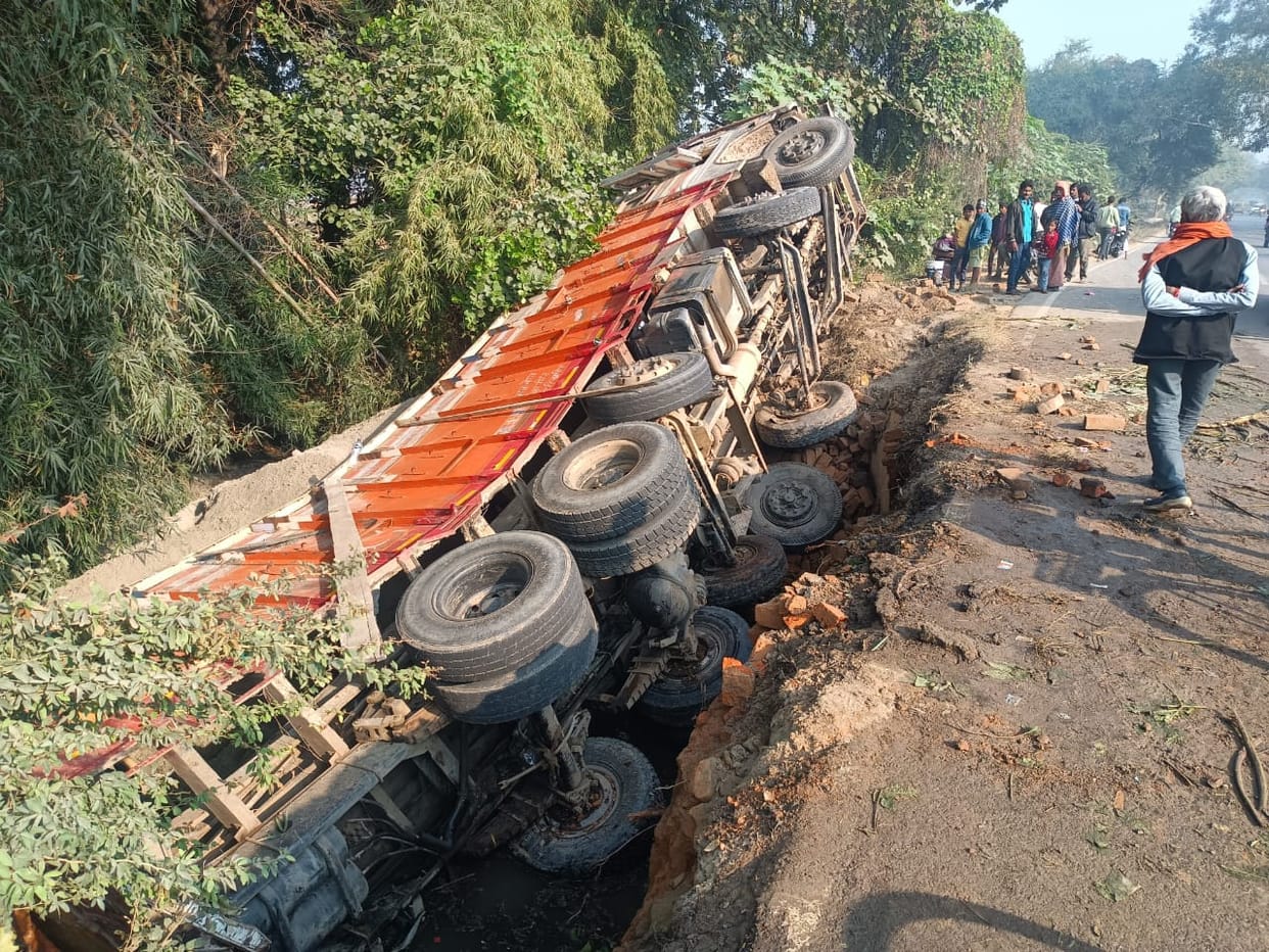 Truck breaks railing and falls under culvert