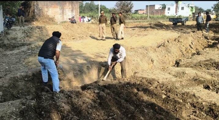 The administration got the pits dug in the farmer's field filled up.