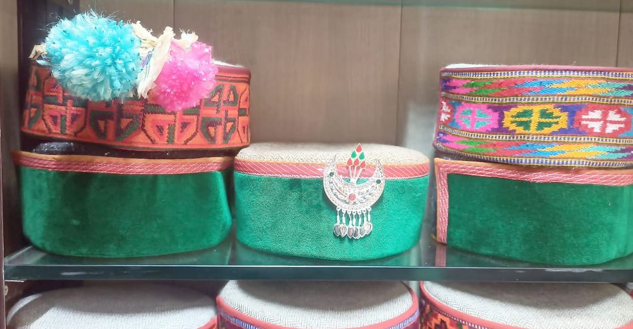 Instead of a turban, a shining silver-crowned cap on the head