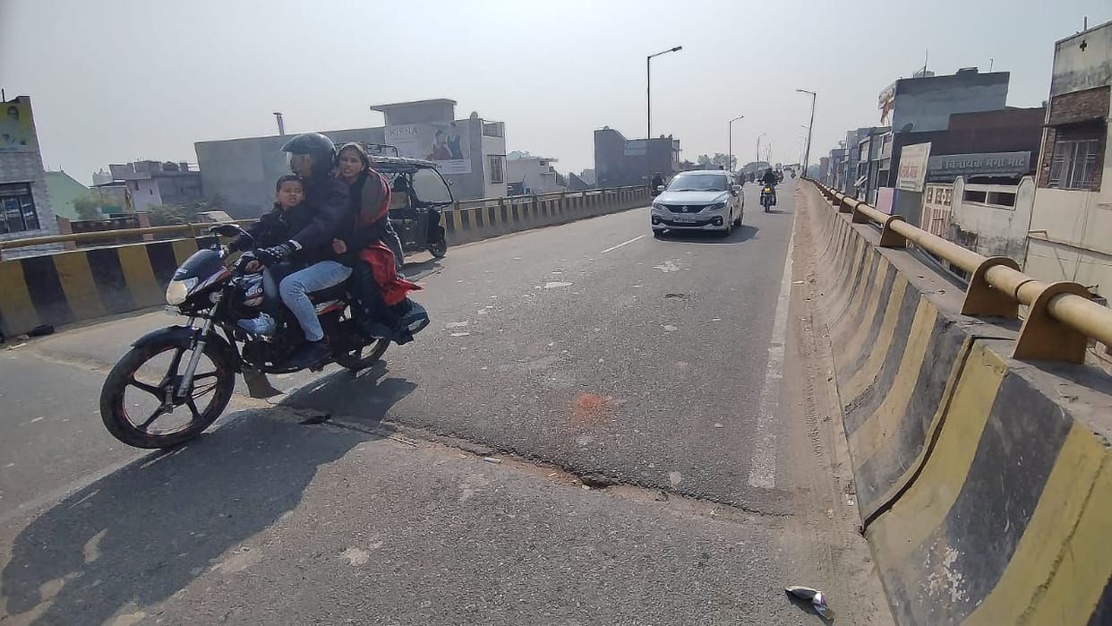 Potholes on flyover... vehicles going out of control