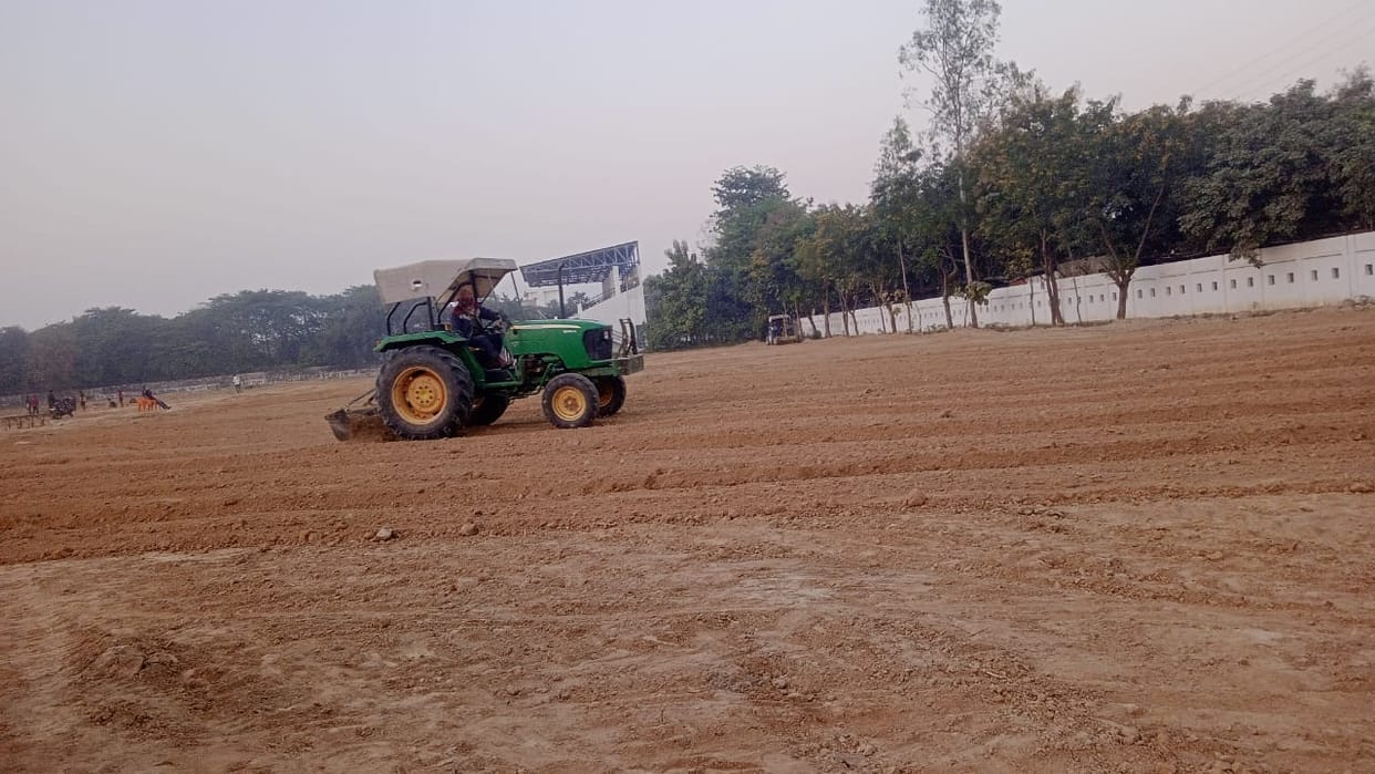 The stadium complex is being raised by adding soil.