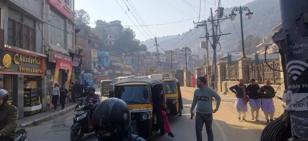 Shop on the footpath, pedestrians on the road