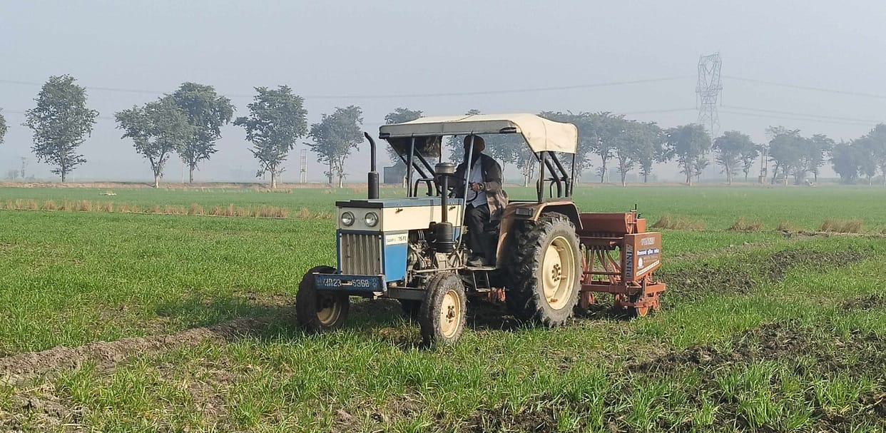 Tractor driven in two acres of standing wheat crop