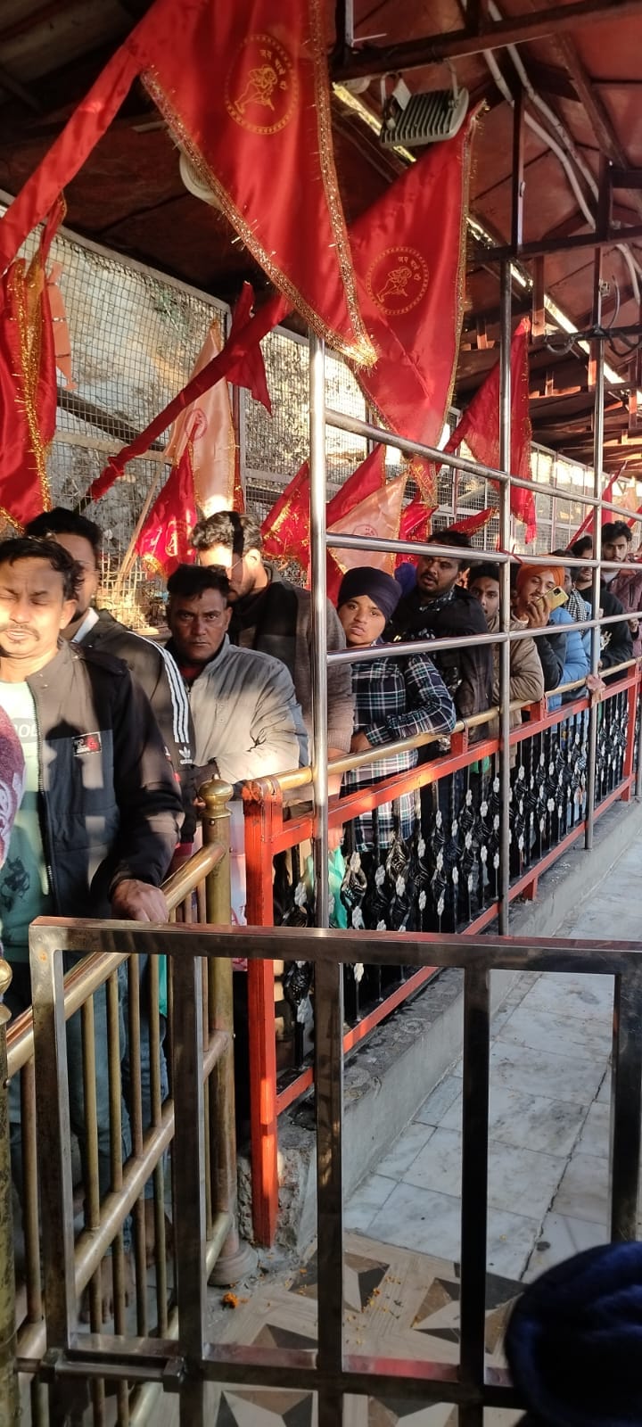 Devotees bow down after offering roti in the court of Paunahari