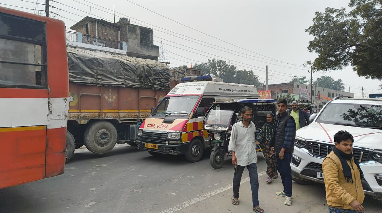 Pedestrians and ambulance stuck in traffic jam amid protest