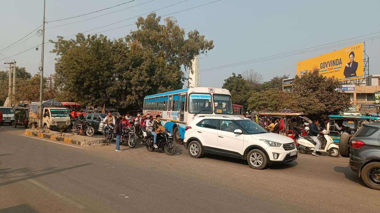 There is a jam due to buses outside the old bus stand of the city