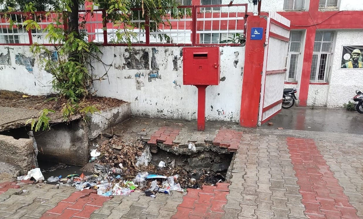 The pit outside the main post office is inviting an accident