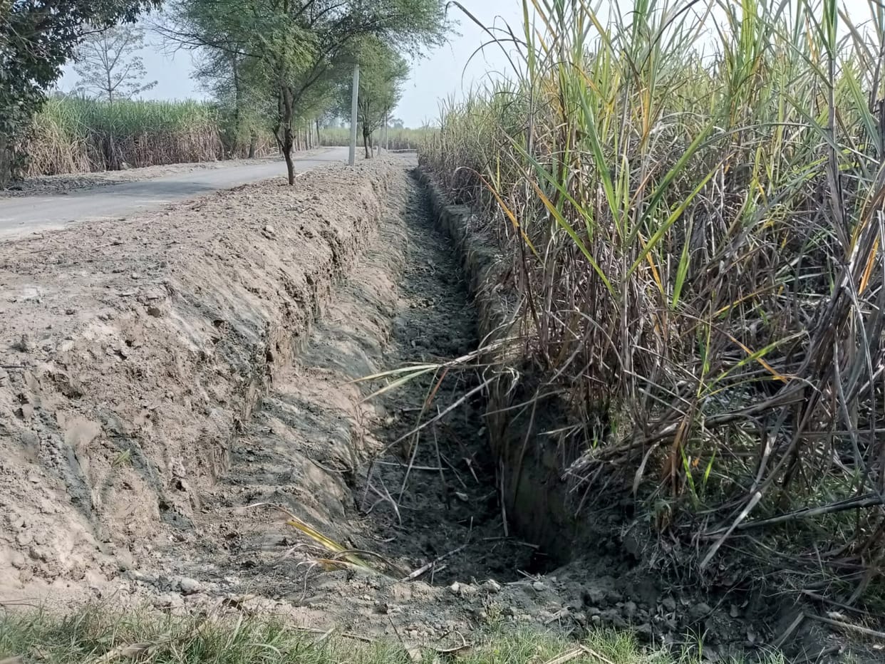 Road built from soil dug up after destroying crops, farmers angry