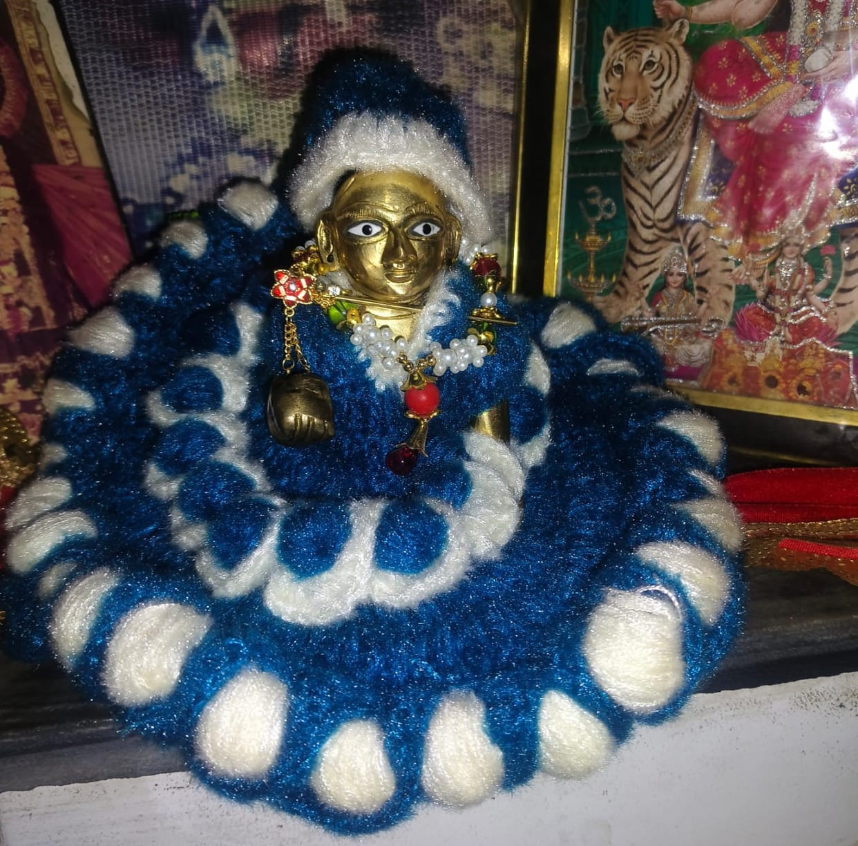 God is being made to wear sweater in cold weather