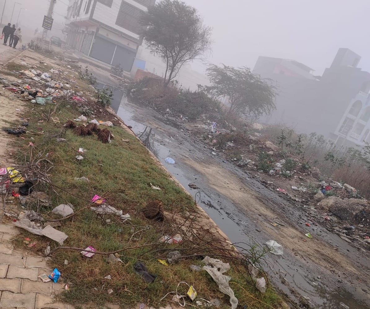Dirt spread on the footpath built on the drain road, people are troubled