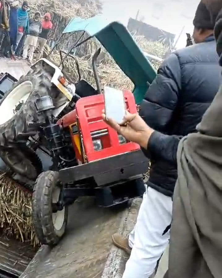 Sugarcane tractor-trolley fell into chain carrier