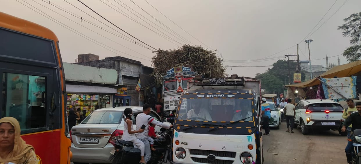 Sugarcane trucks kept jamming Sardhana throughout the day