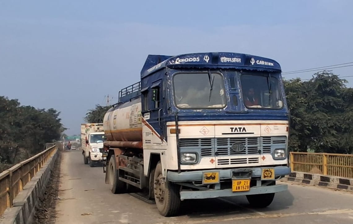 Heavy vehicles leaving damaged bridge, feared hit