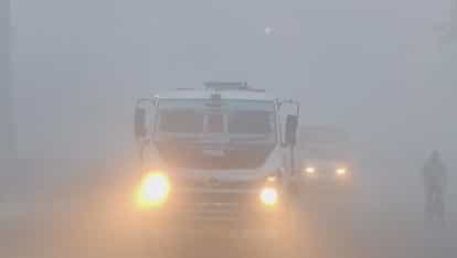 Shivering from the cold, shadow and dense fog