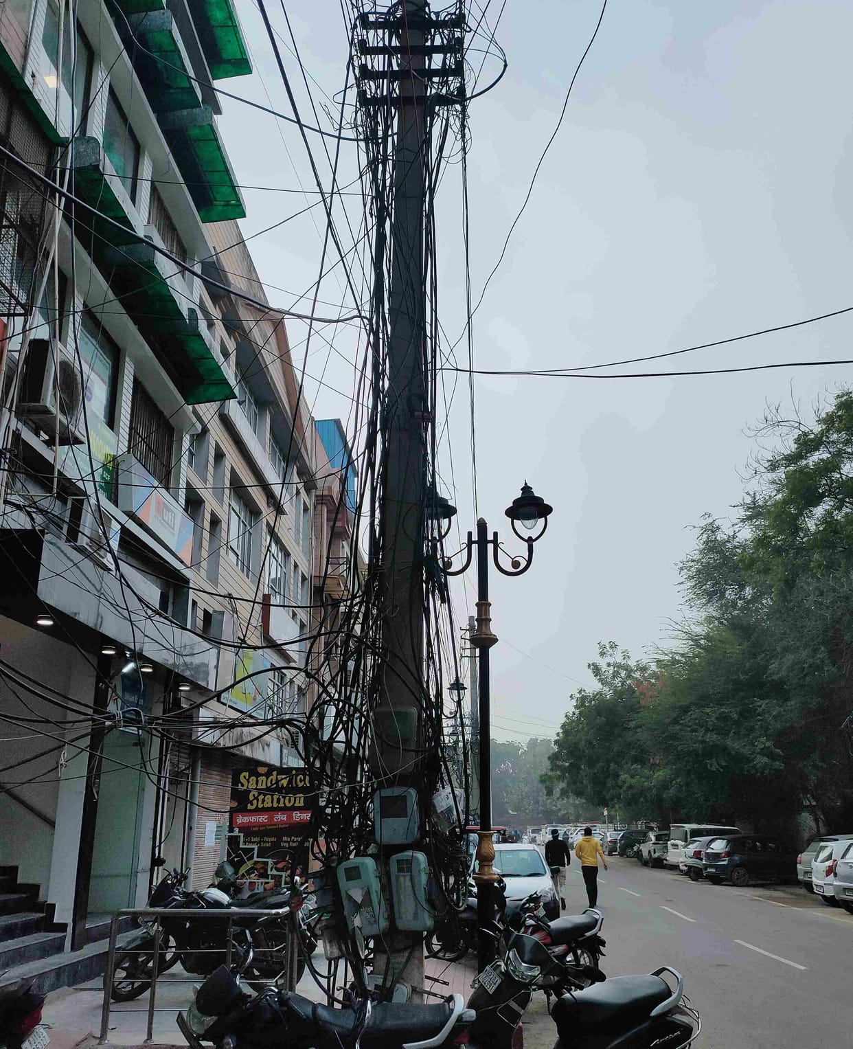 4 decade old red and green square market becomes dumping point, web of wires on pillars