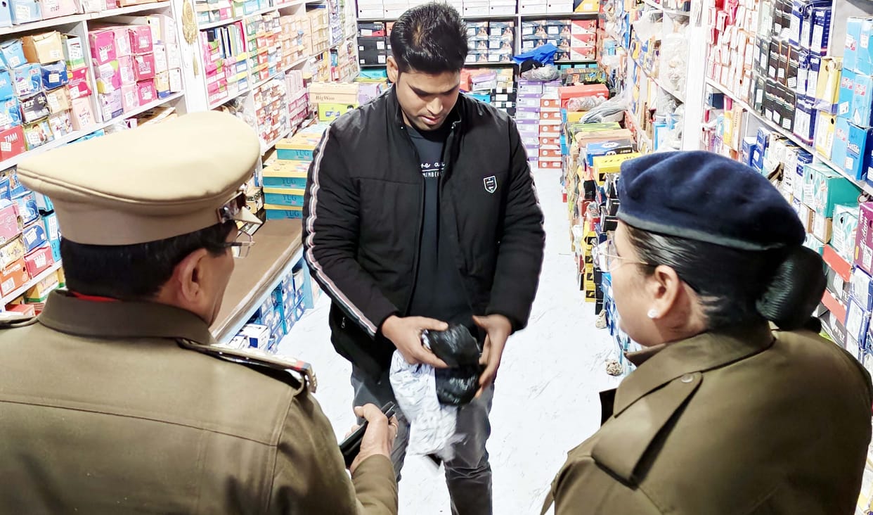 A pistol and suspected narcotics were recovered from a shop in front of the police station