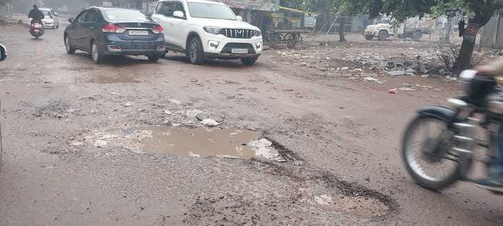 Potholes formed due to rain on the bad roads of the city