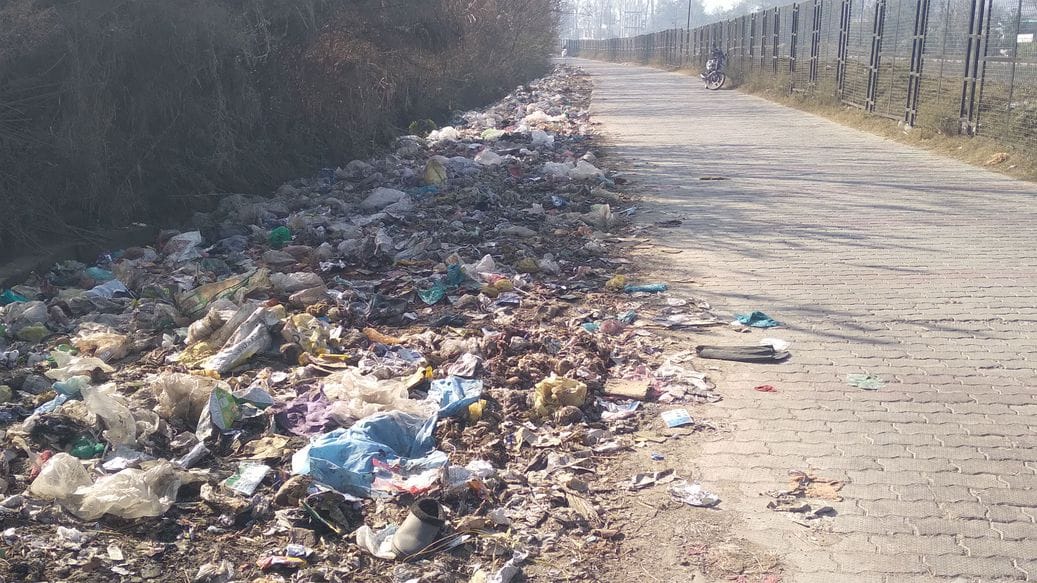 Garbage piles on the side of Mahadev Road
