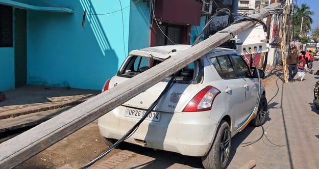 Electric pole fell on a car parked on the roadside, created panic