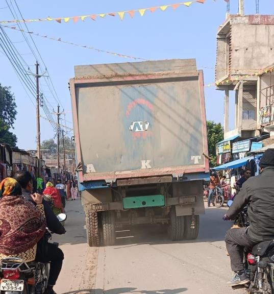 Overloaded trucks and dumpers speeding on the road without number platesOverloaded trucks and dumpers speeding on the road without number plates