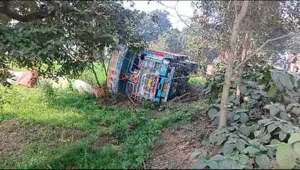 Truck overturned while trying to save a bike rider, 12 injured including the driver