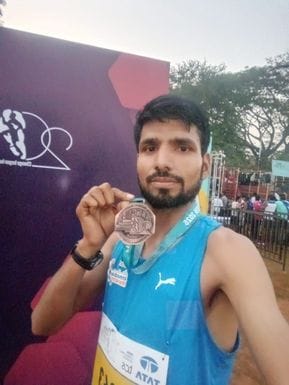 Pritam won bronze medal in Asia's biggest marathon