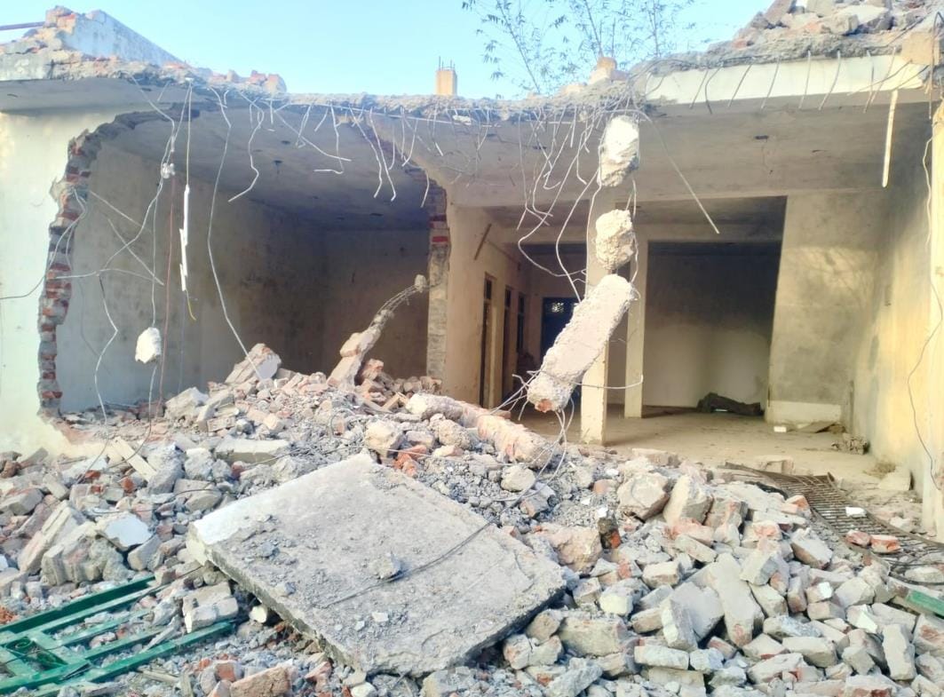 Bulldozer runs on former Pradhan's illegal house
