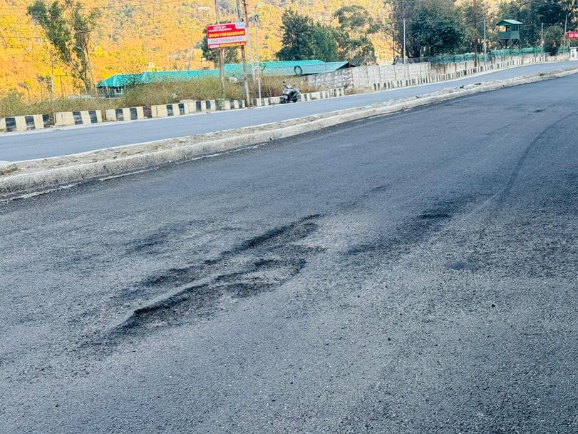 The tarring of the four-lane road near Pandoh was uprooted in just 15 days