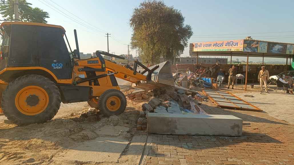 The District Planning Department demolished illegal constructions on Bhuna Road