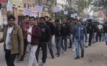 Electrical workers protested by taking out a candle march