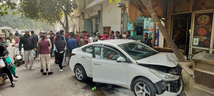 Car hits female professor riding scooter