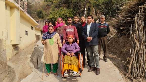Deputy Commissioner delivered the wheelchair of disabled Santosh by building a road to his house.