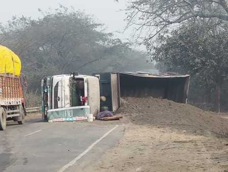 Truck full of dust overturns near Ganganahar bridge
