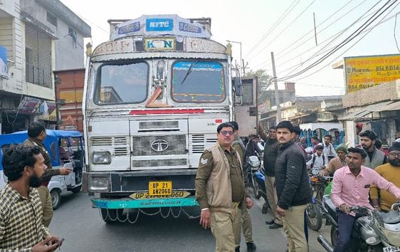 Woman dies after being hit by truck, husband and daughter injured