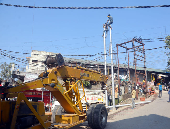 The work of shifting electric poles from the middle of the roads in the city has started.