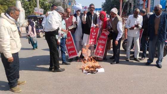 Union members took out a protest march and burnt copies of the budget.
