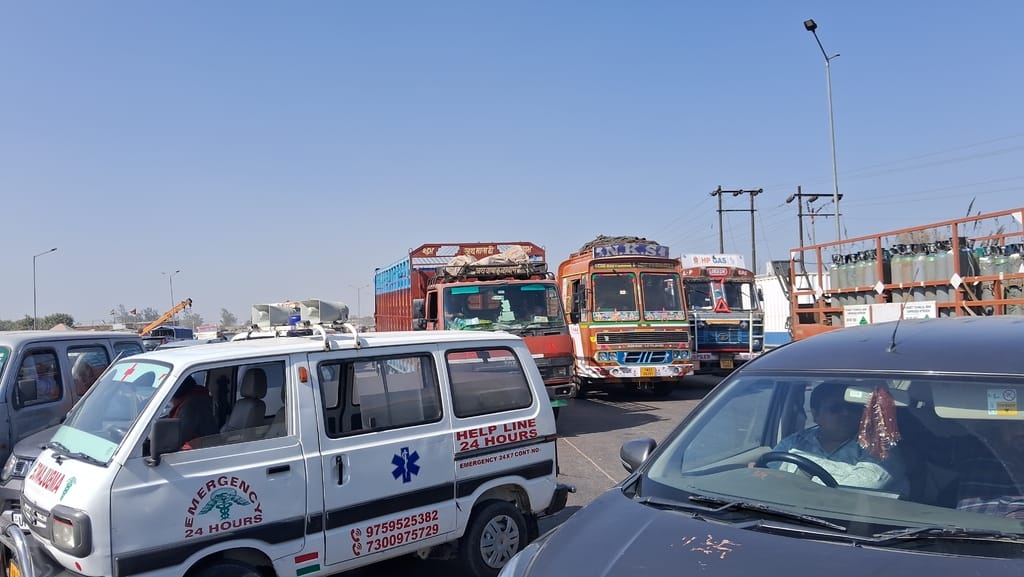 Long queues of vehicles forming at toll plaza