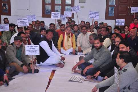 People of Jain community staged a sit-in protest demanding financial help for the victims