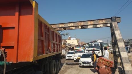 Trolley stuck in girder of railway bridge, jammed