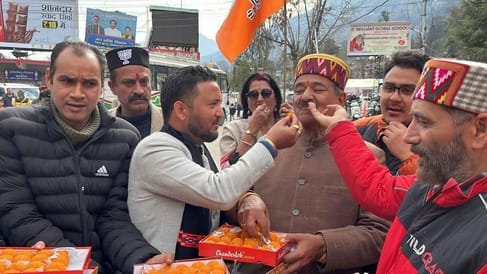 Celebrated victory in Delhi by bursting crackers and distributing laddus.