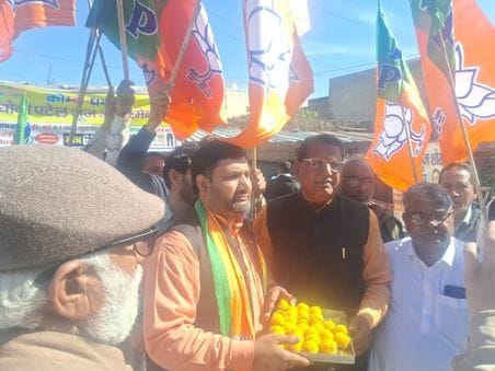 BJP workers distributed laddus after winning elections in Delhi.