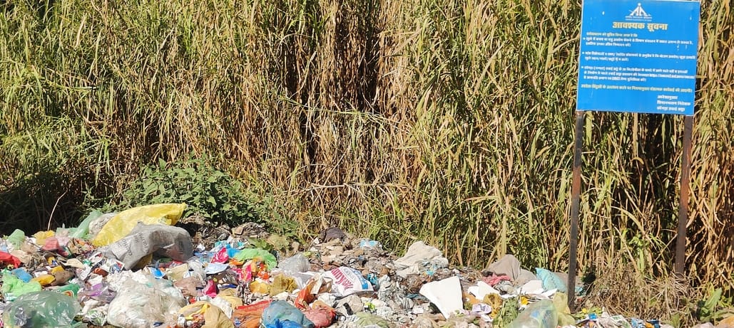 People throw garbage carelessly and don't even care about warning boards.